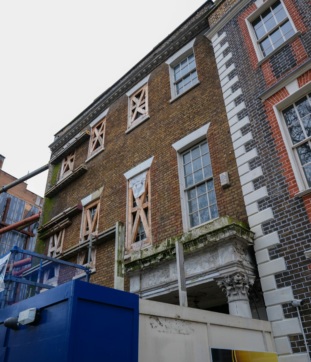 UK brick property renovation with scaffolding on site