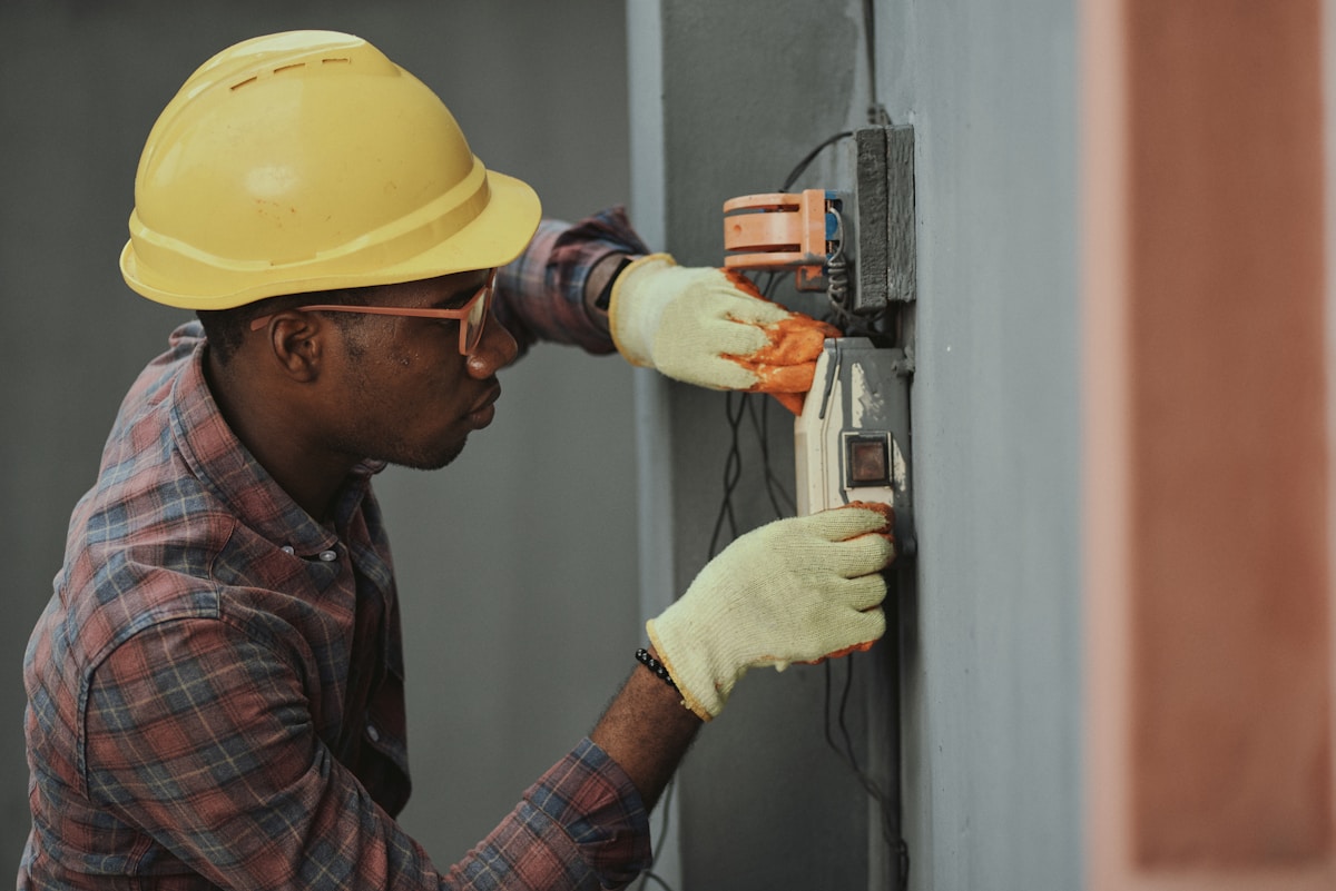 Electrician working on wiring and installation